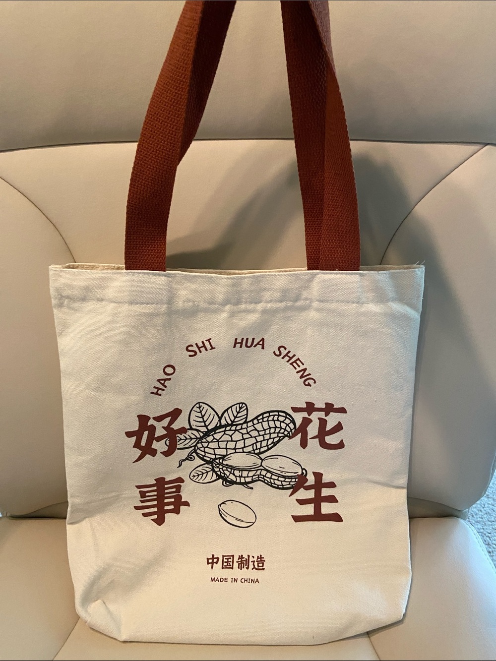 Canvas Tote Bag with Brown Handles and Red Graphic